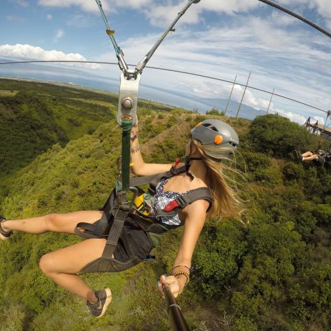 a man riding on top of a hill