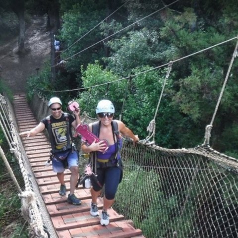 a group of people walking on a bridge