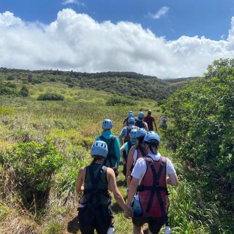 a group of people standing in a field