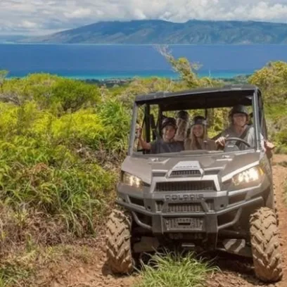 a truck driving down a dirt road