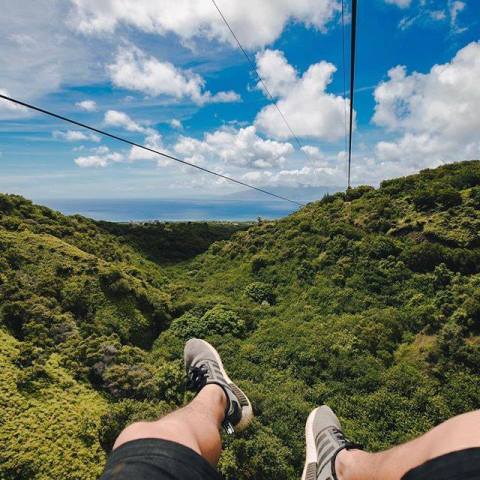 a man standing on top of a hill
